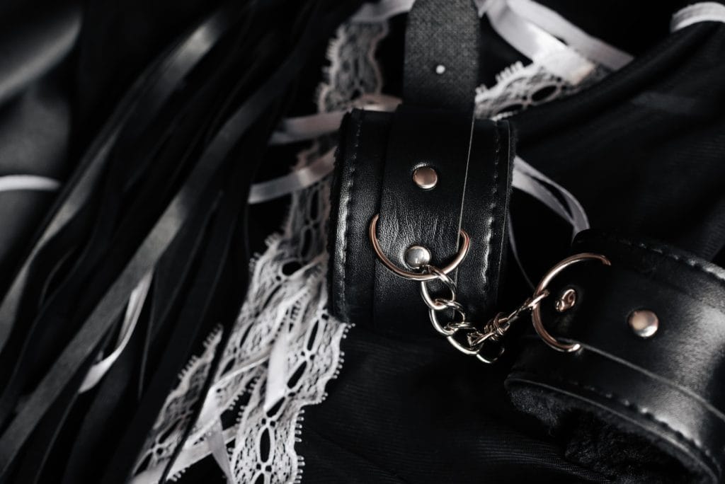Leather cuffs, lace and chain, bondage and restraint in London