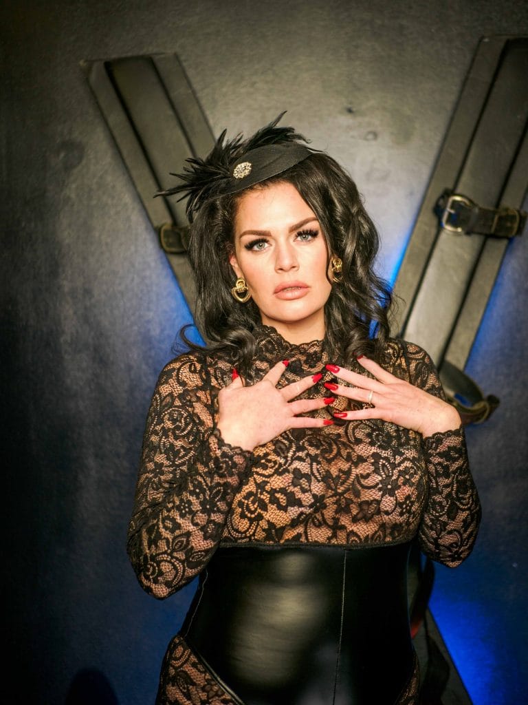 Mistress Charlotte before a St Andrew’s cross, bondage mistress in London